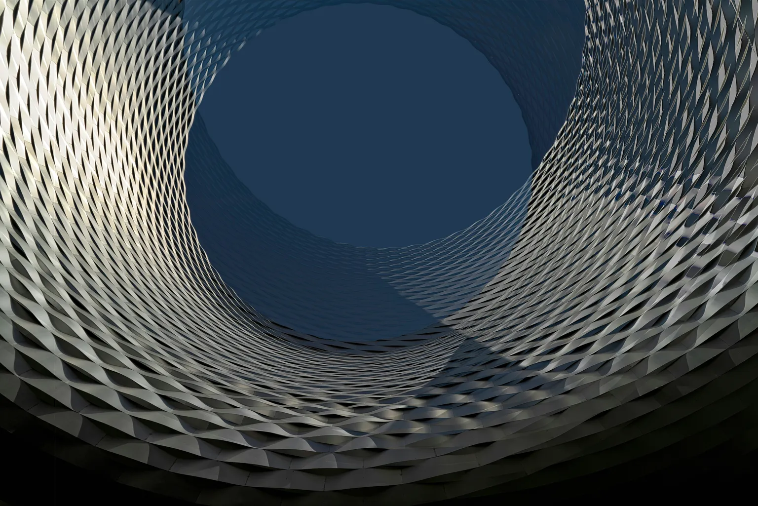 Abstract background image of a building with geometric shapes.